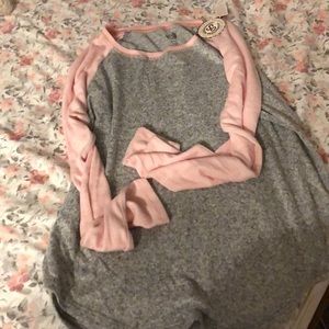 Pink and gray long sleeve shirt.